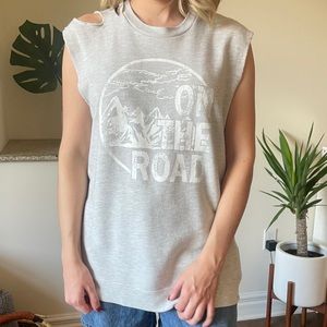 Distressed sleeveless sweater.